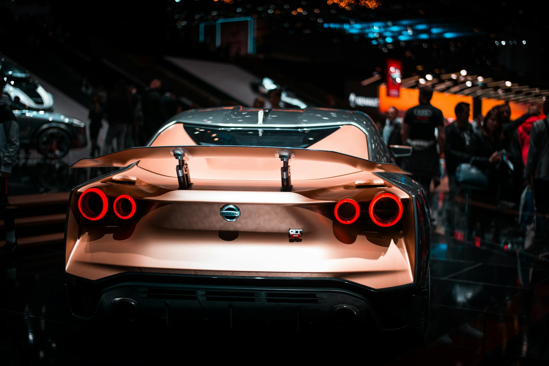 Turin Motor Festival — Rear view of a luxury sport car with striking tail lights at a car show.