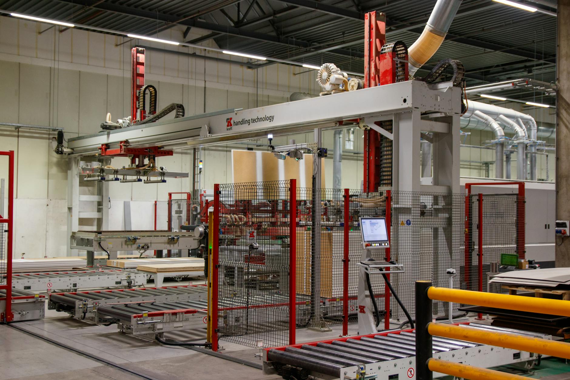 fondi Transizione 5.0 — Industrial machinery with robotic arm in a modern manufacturing facility.