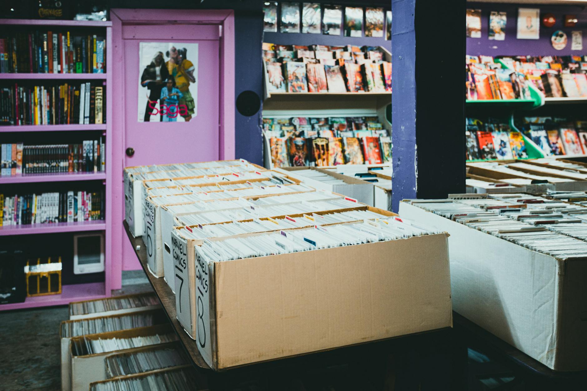 Generazione Fumetto — A colorful comic book store with organized shelves and boxes of comics for sale.
