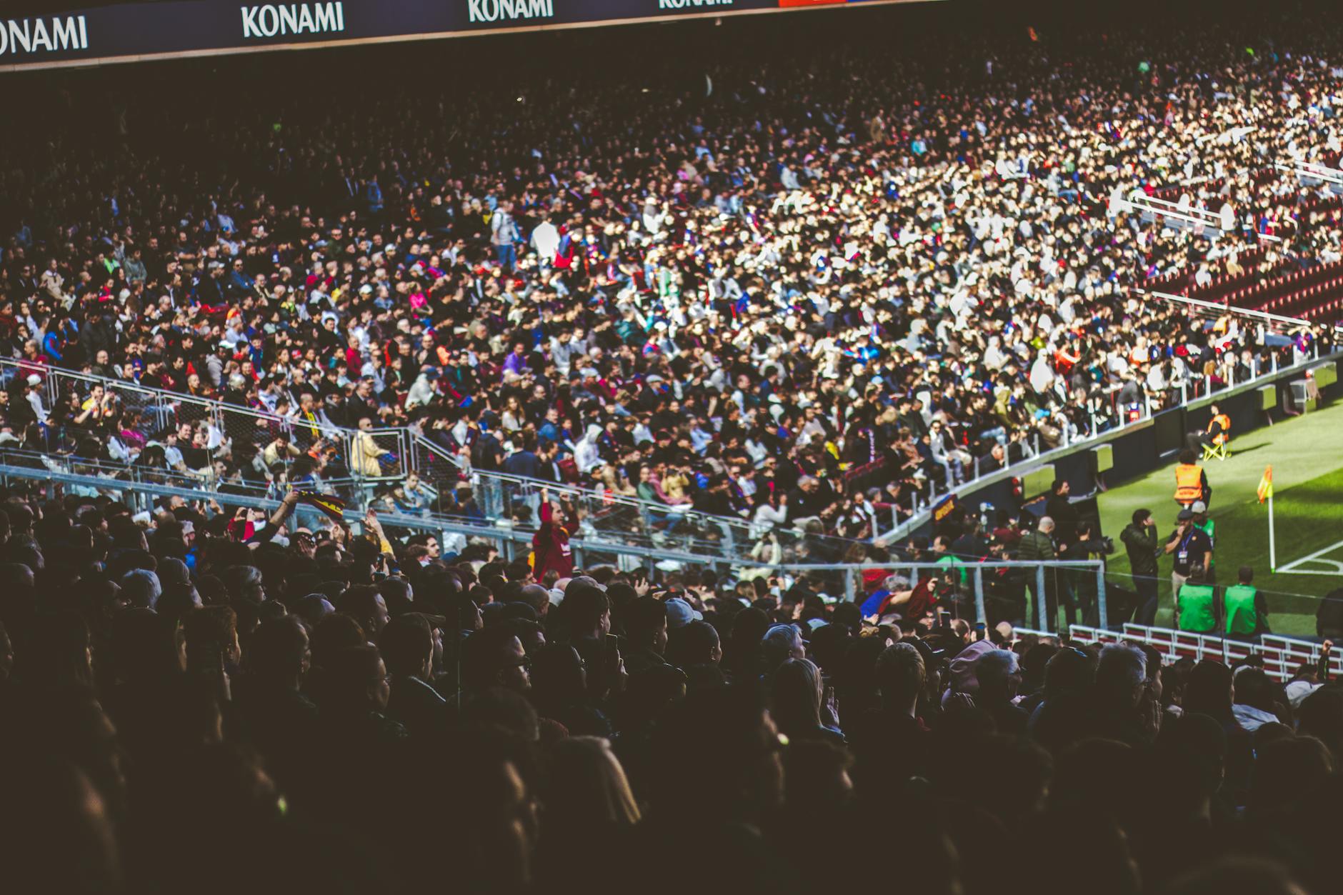 corsa Champions League — A crowded soccer stadium packed with enthusiastic fans during a match.