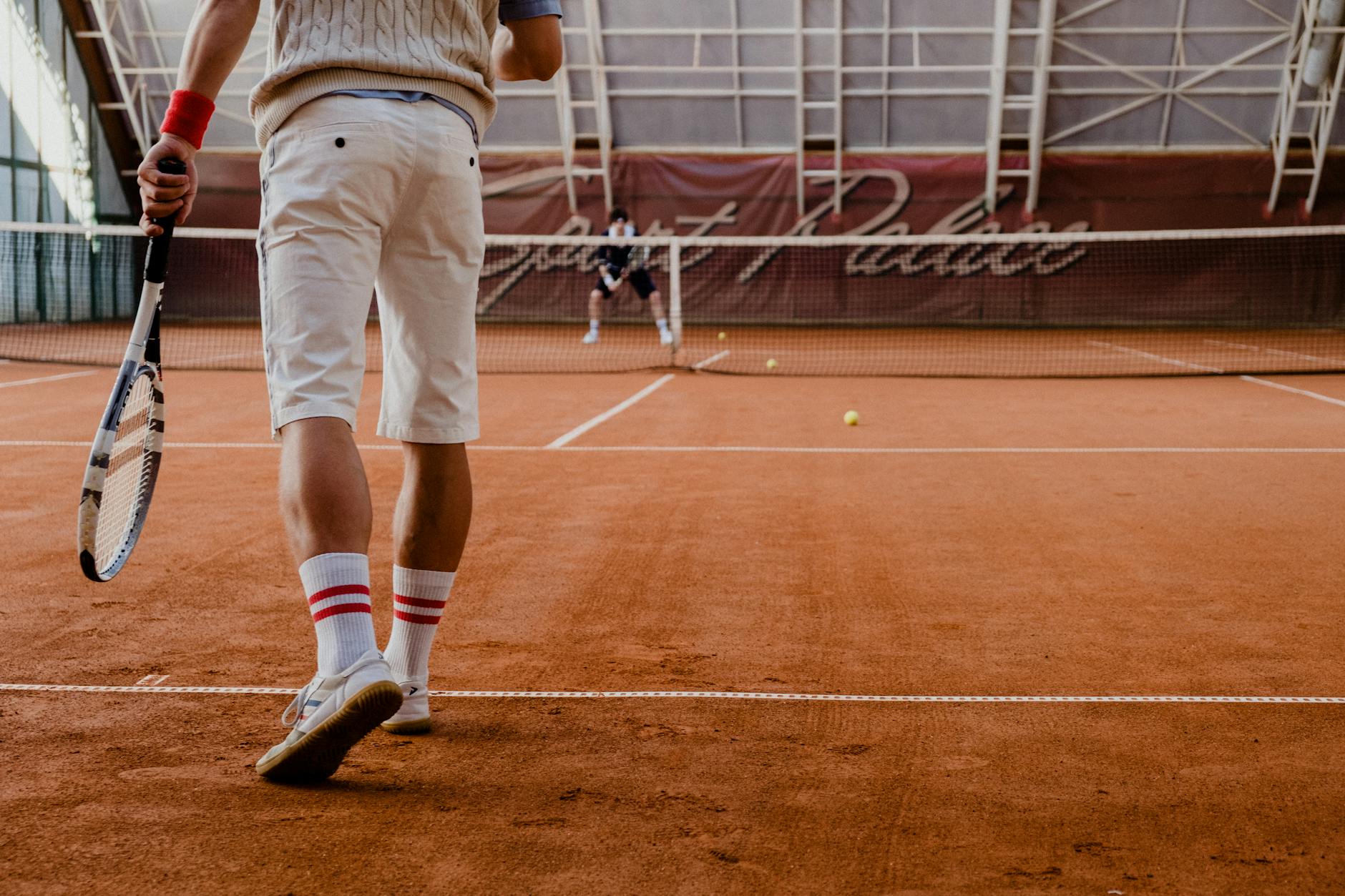 Internazionali d'Italia — Players competing in a tennis match on an indoor clay court.