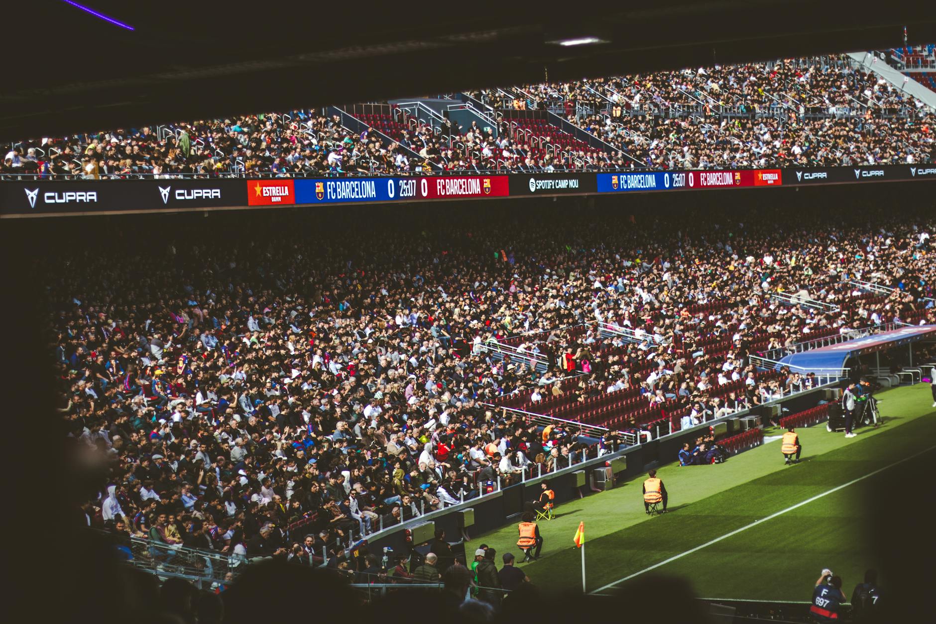 titolo Liga — Packed stadium with spectators at an FC Barcelona soccer match, vibrant atmosphere.