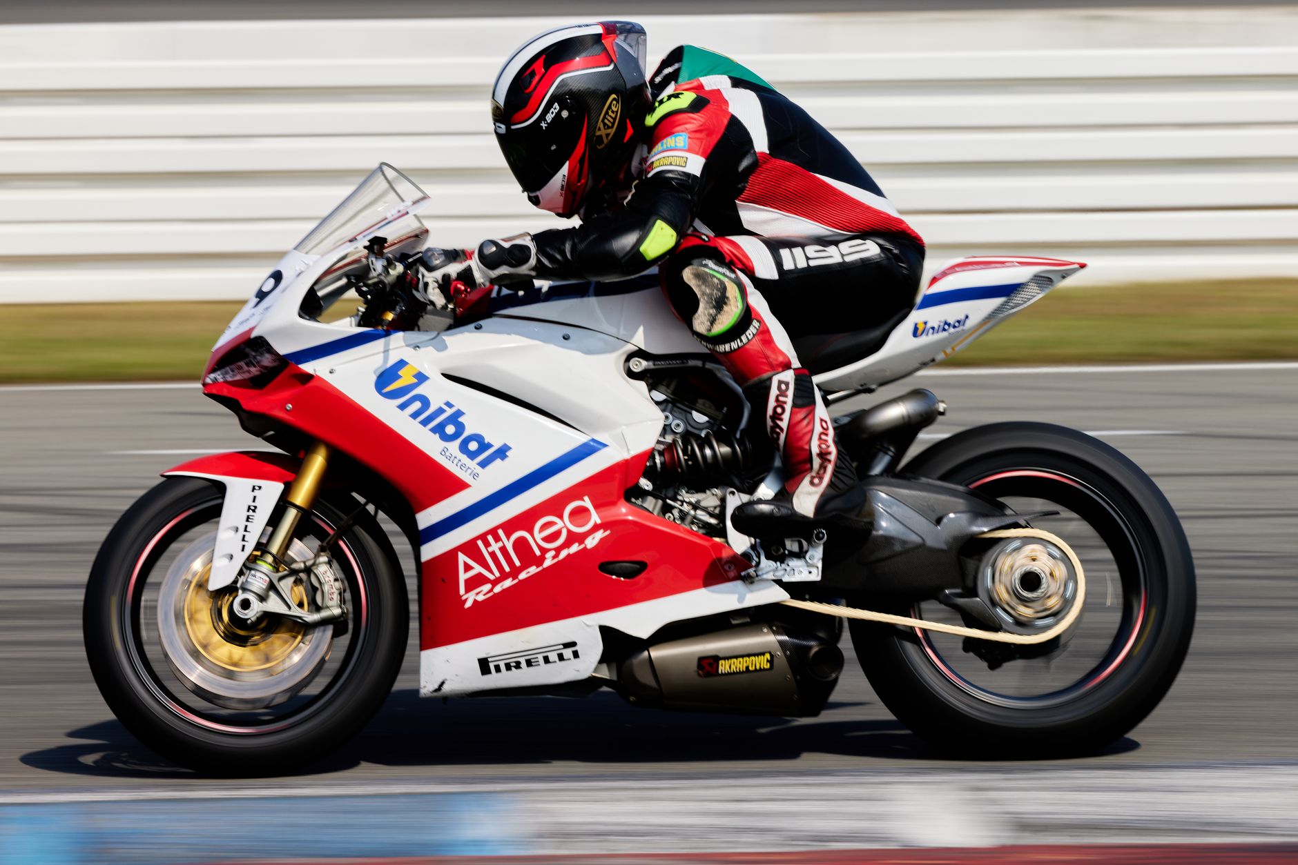 Sprint MotoGP Austria — Close-up of a professional motorcycle racer speeding on track. Dynamic and thrilling motorsport action.